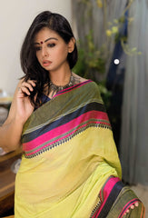 Lime yellow Bengal loom saree with black and pink stripes, paired with silver jewelry.
