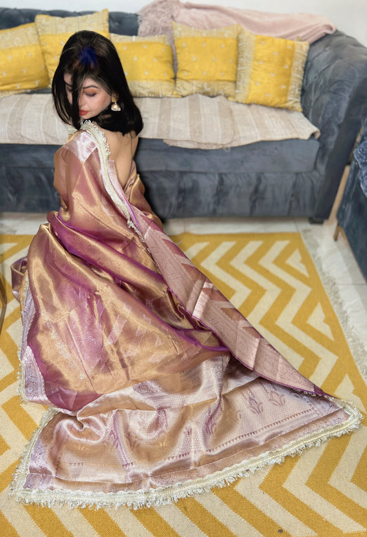 Royal gleam purple and copper zari tissue silk saree with intricate border and glossy finish.