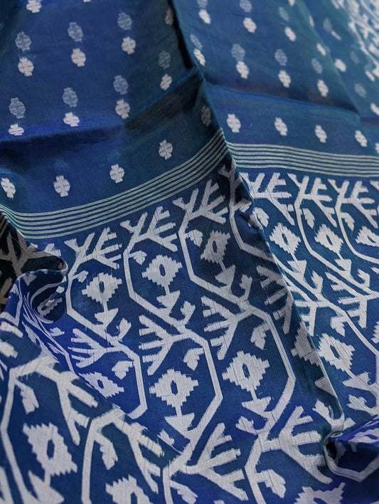 Navy blue cotton silk fabric with white floral Dhakai Jamdani patterns and intricate vine border designs.