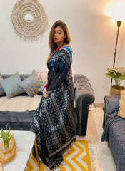Black and white Bengal Dhakai Jamdani saree with intricate geometric patterns draped on model.
