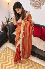 Premium Rust Tissue Silk Saree With Elegant Zari Border