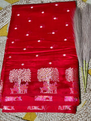 Scarlet red Banaras silk saree with small white polka dots and intricate silver tree motifs border.